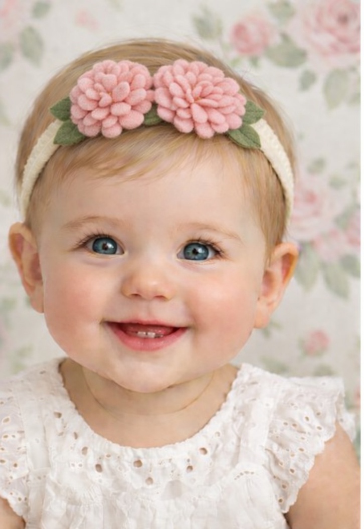 Elegantes Baby Haarband mit Blumen in Rosa und Grün