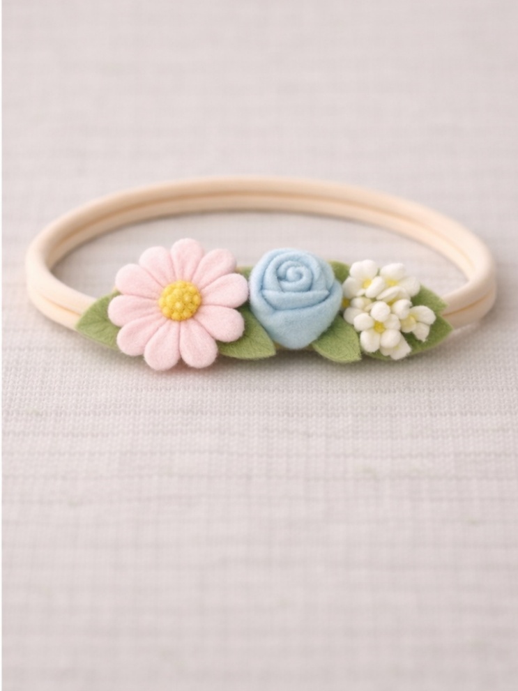 Diadema de flores suculentas e margaridas para bebê