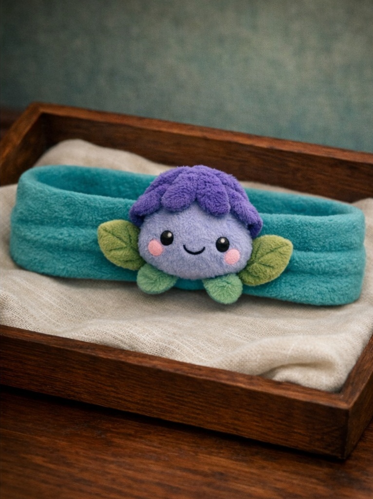 Bandeau bébé peluche fleur violette douce, pensé pour séduire les acheteurs B2B