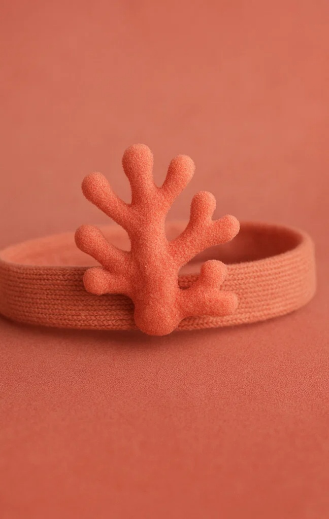 Playful Coral Baby Headband with Fun Details