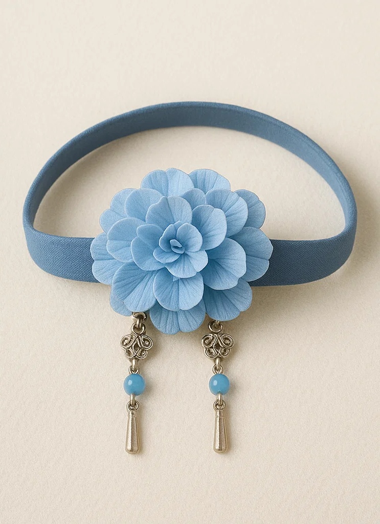Bandeau bébé brodé avec fleur et accent de feuille