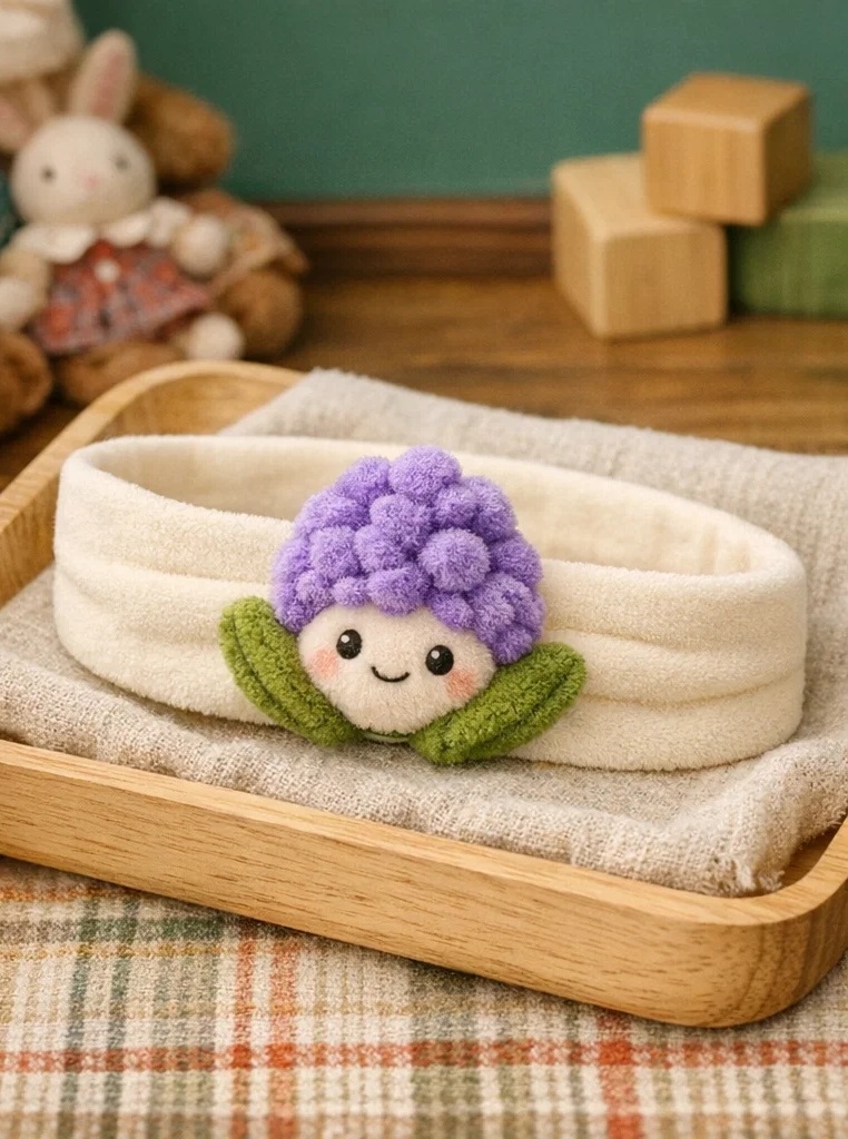 Bandeau bébé avec fleur violette en peluche – un article gagnant pour grossistes et boutiques cadeaux