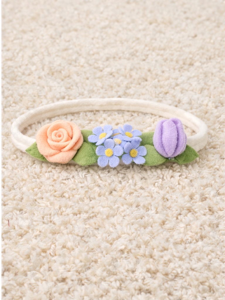 Bandeau bébé fleurs pastel – rose pêche, bleu myosotis et tulipe violette