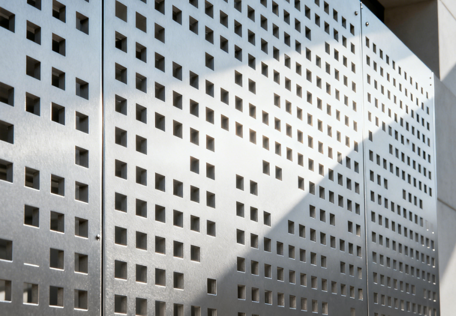 Low-Volume Airflow Façades with Integrated Metal Sunshades and Dispersed Outlets