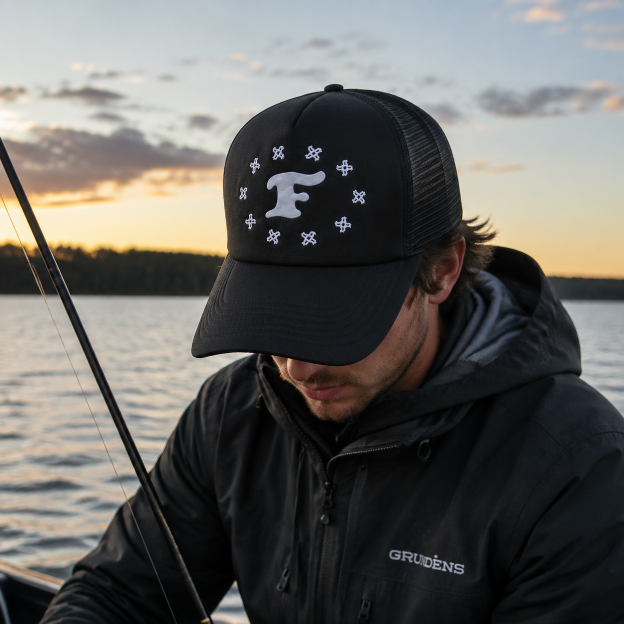 Black Mesh-Back Trucker Cap with White Raised Monogram Graphic
