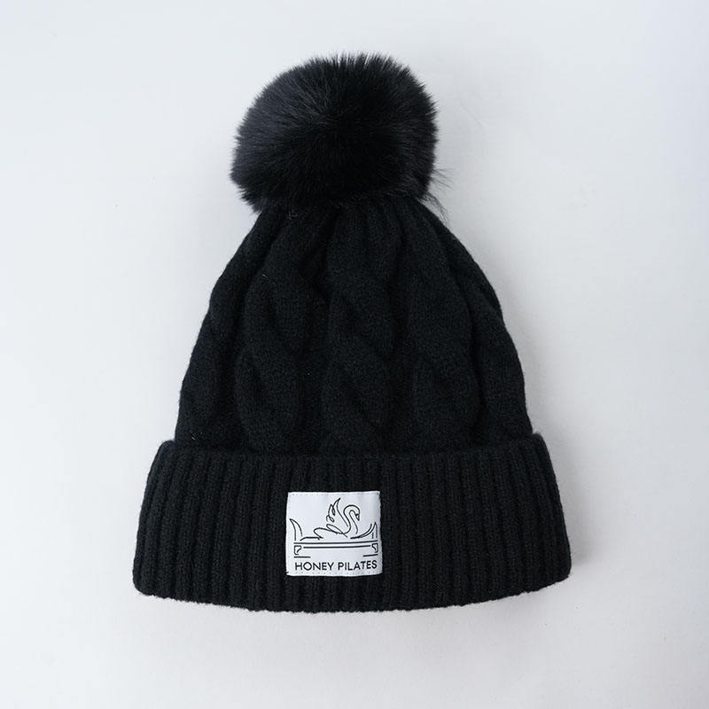 Chunky Cable Knit Cuffed Beanie with Faux Fur Pom Pom and Woven Label