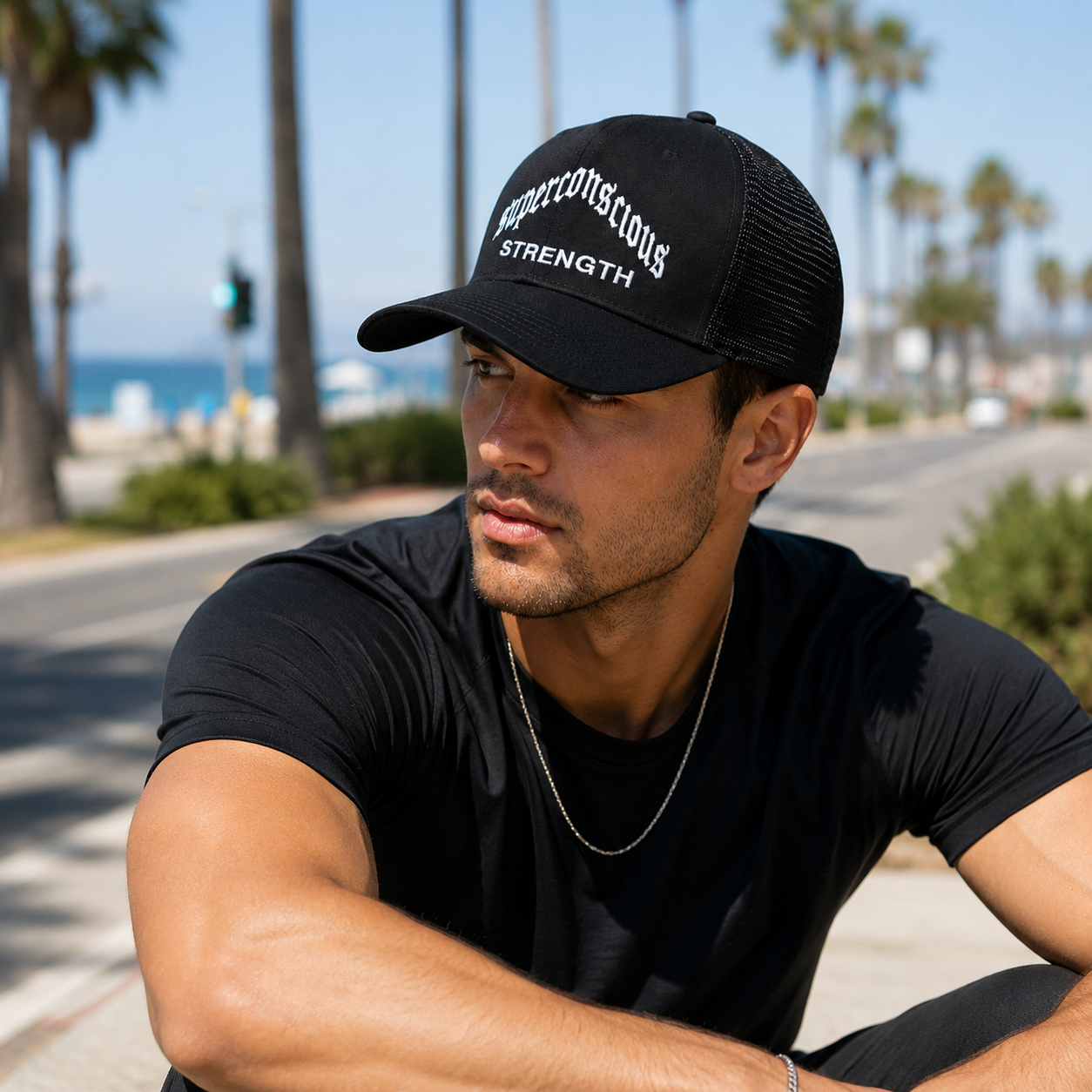 Black Mesh Trucker Hat with White Strength Embroidery