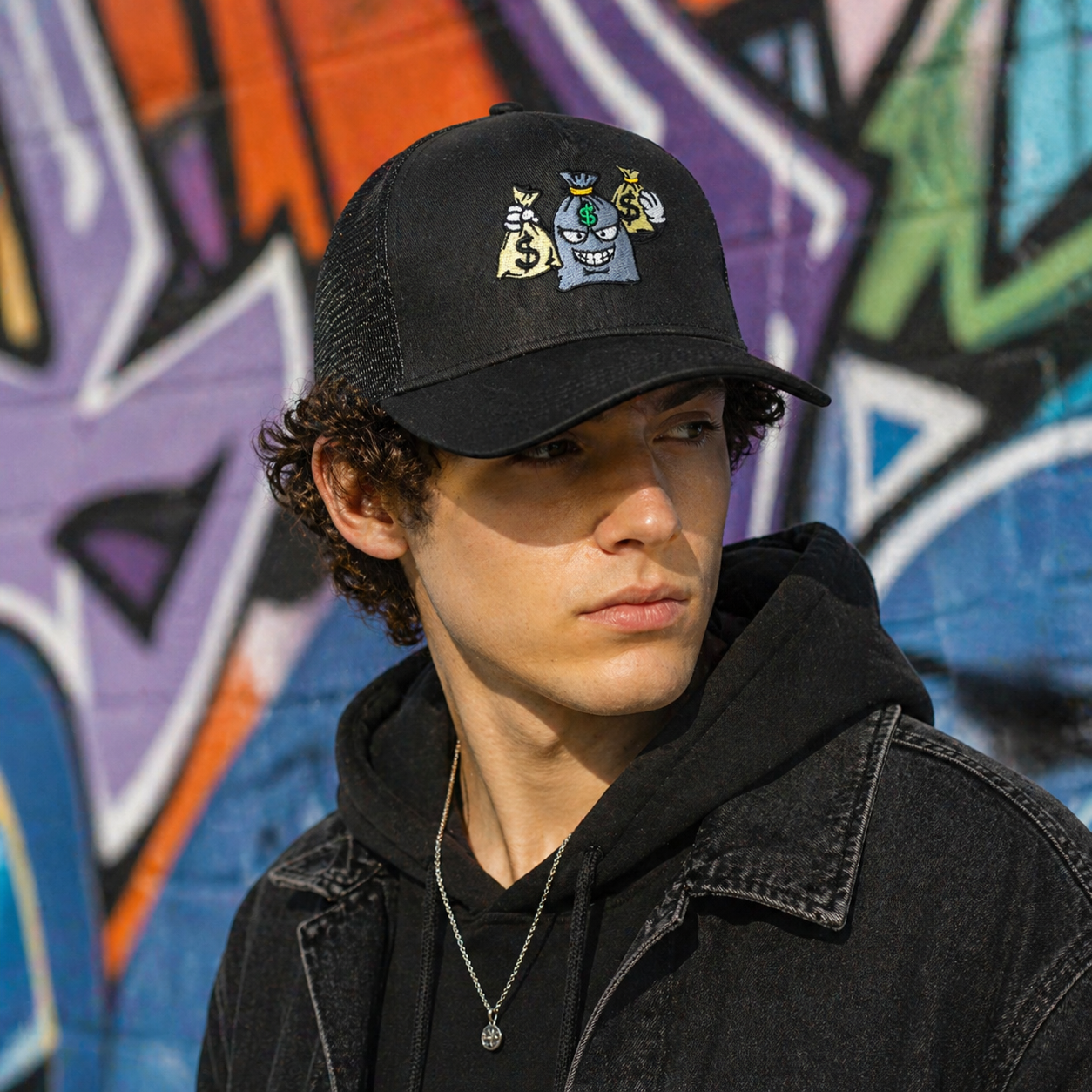 Black 5 Panel Trucker Hat with Embroidered Money Bag Cartoon Logo