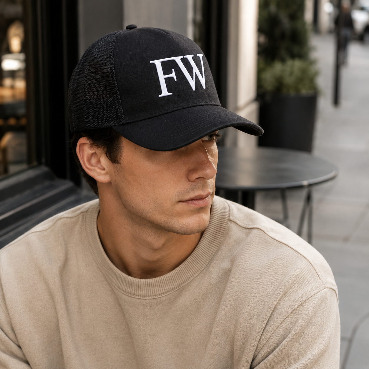 Black Mesh Trucker Hat with White Embroidered A Logo