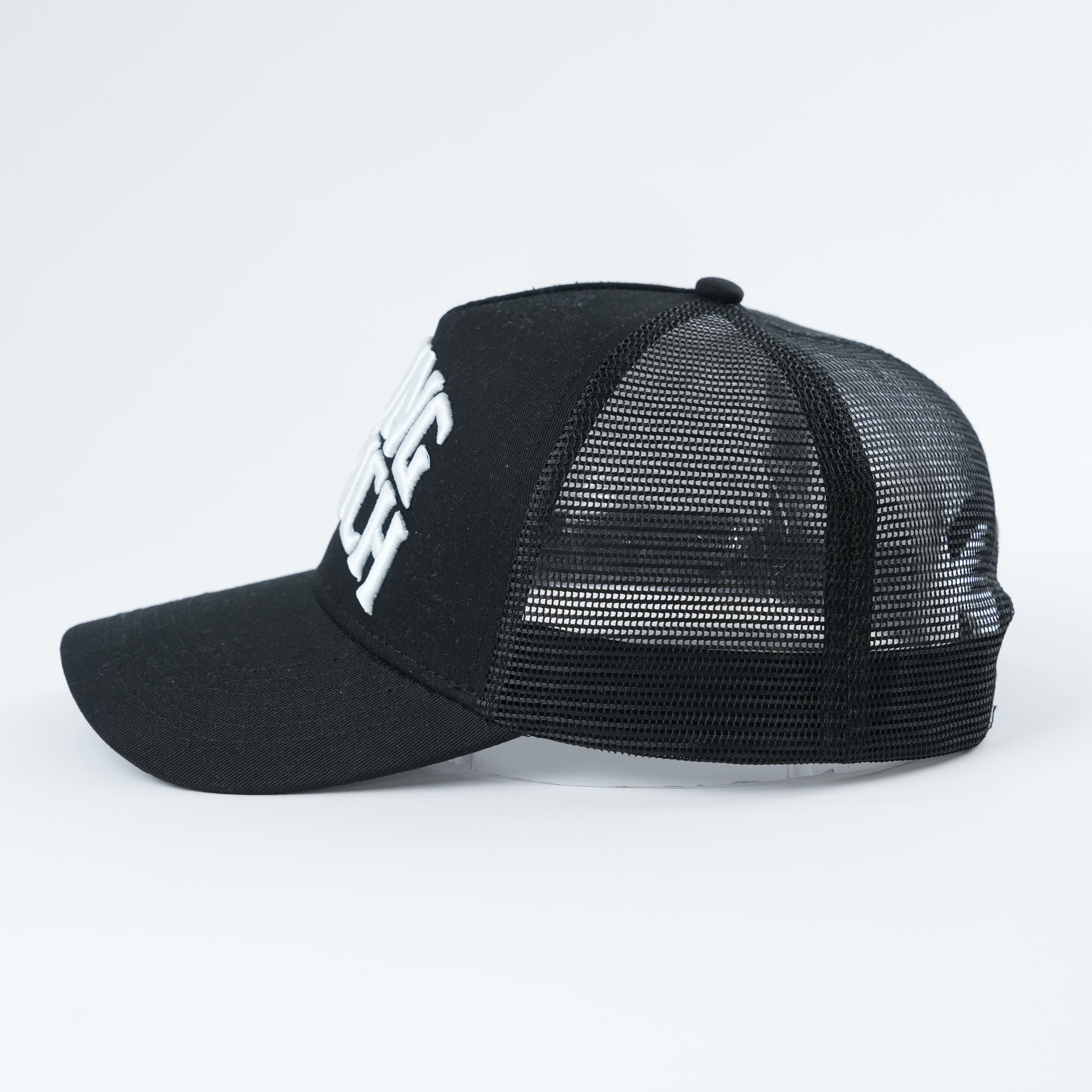 Black Mesh Trucker Hat with Young Zurich Embroidered Slogan Logo