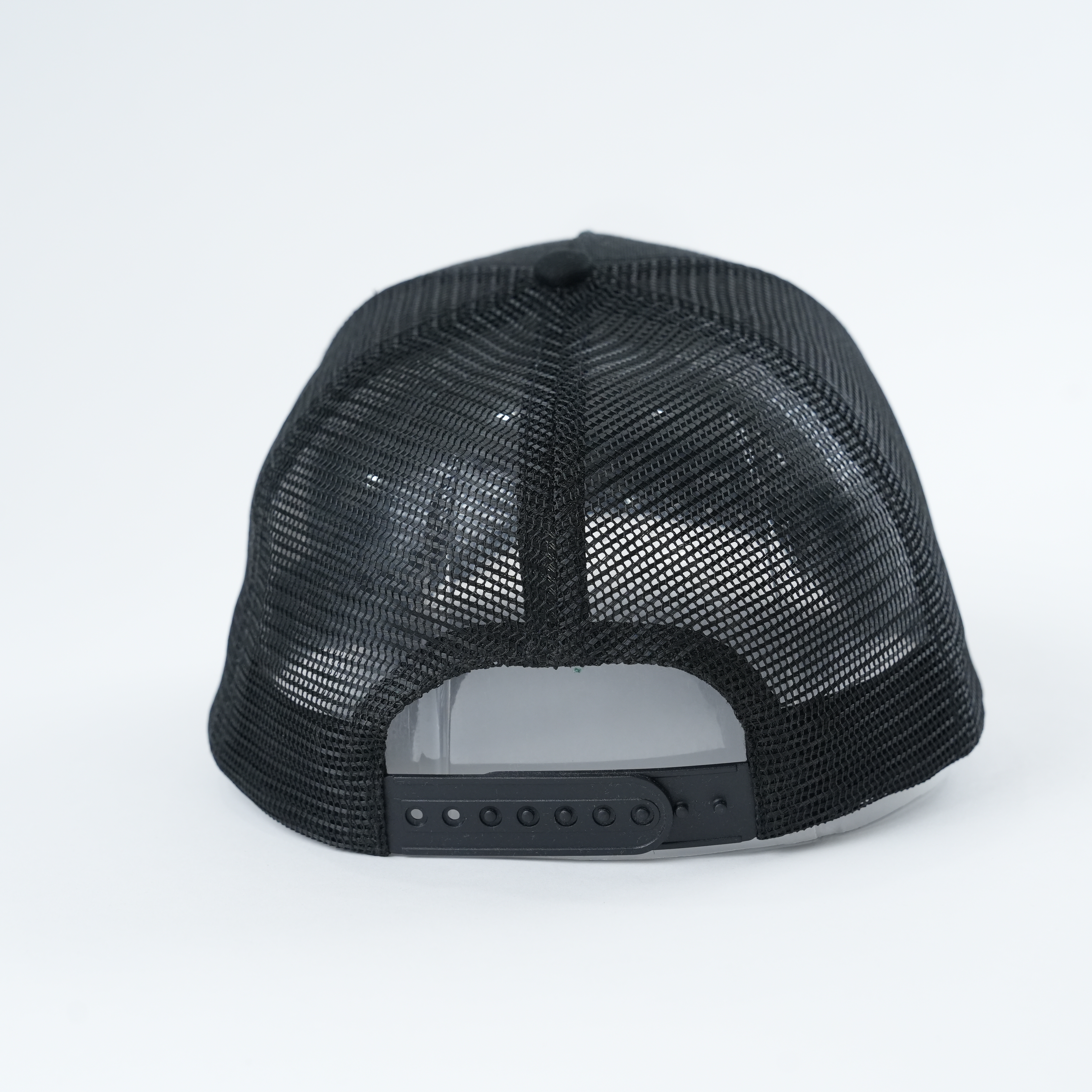 Black Mesh Trucker Hat with Young Zurich Embroidered Slogan Logo