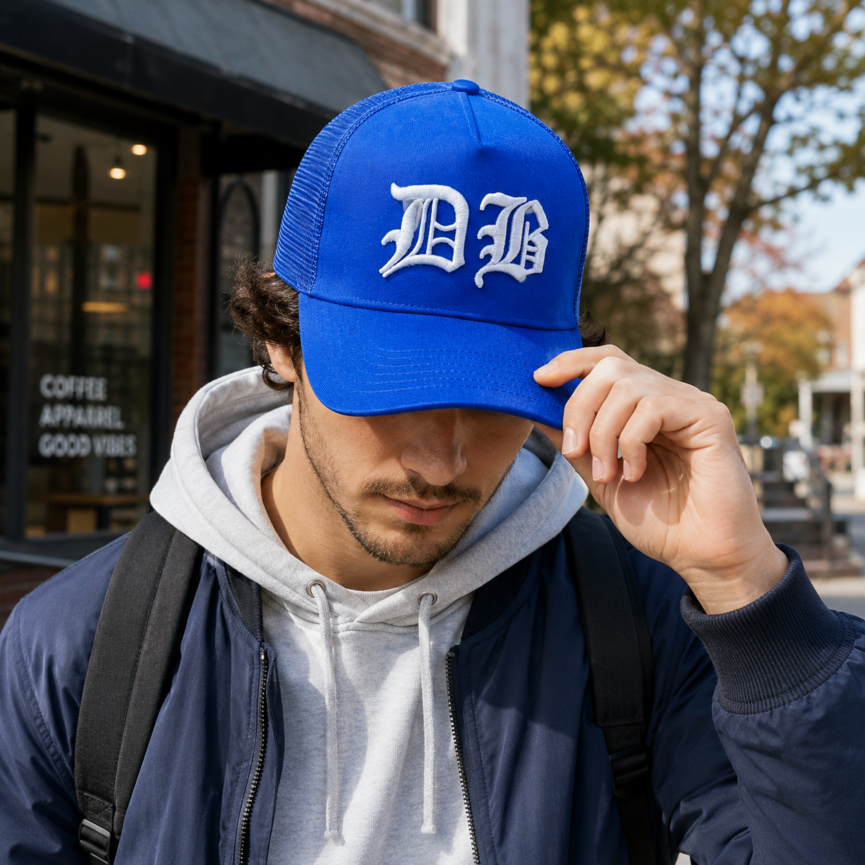Royal Blue Mesh-Back Trucker Cap with Raised White Gothic DB Embroidery