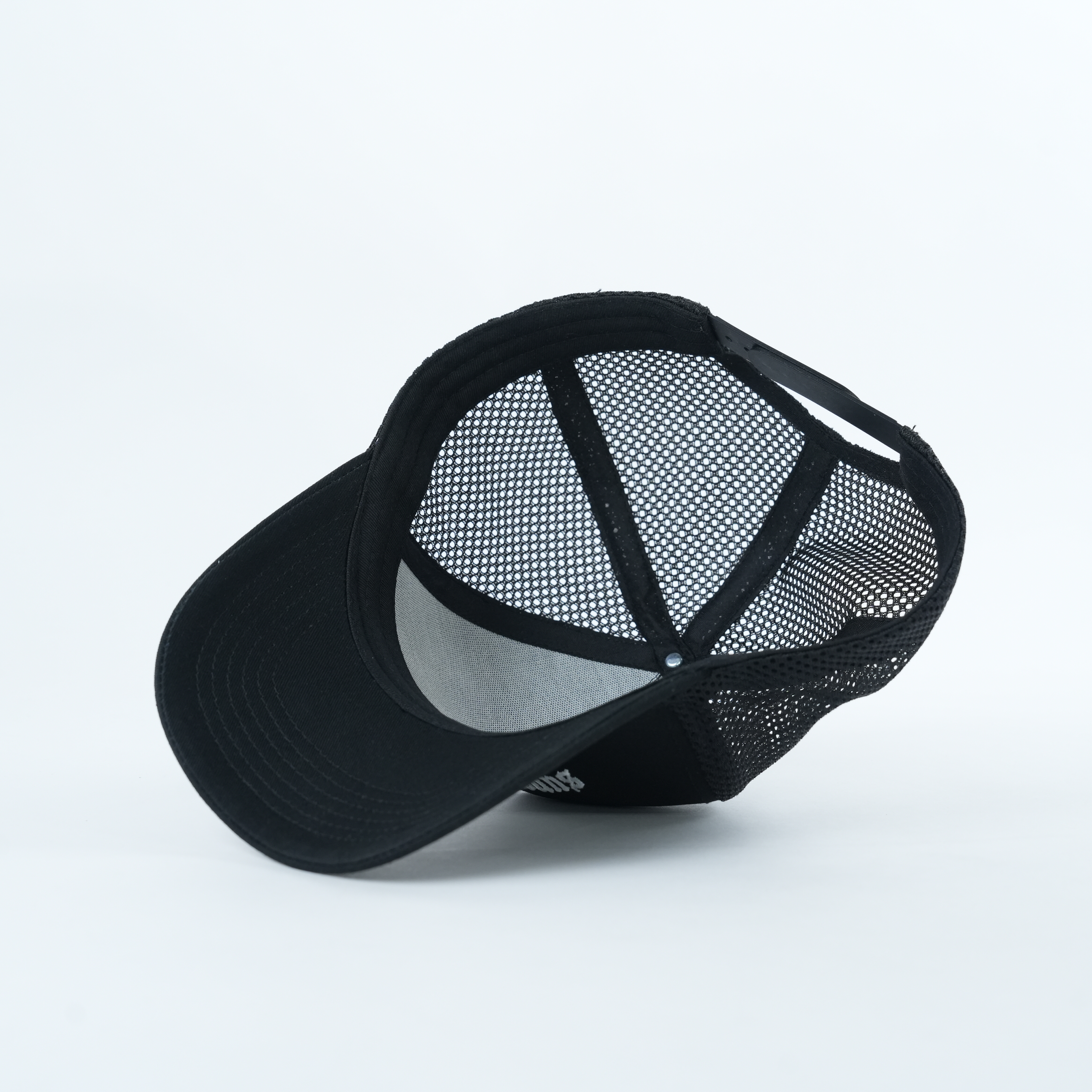 Black Mesh Trucker Hat with White Strength Embroidery
