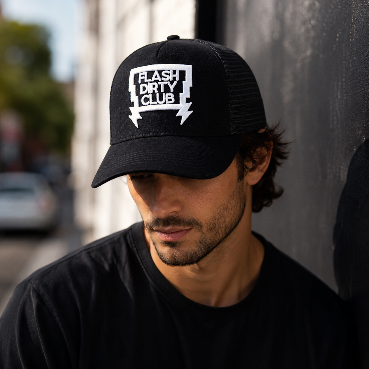 Black Suede Front Mesh Trucker Cap with Bold White Embroidered Graphic