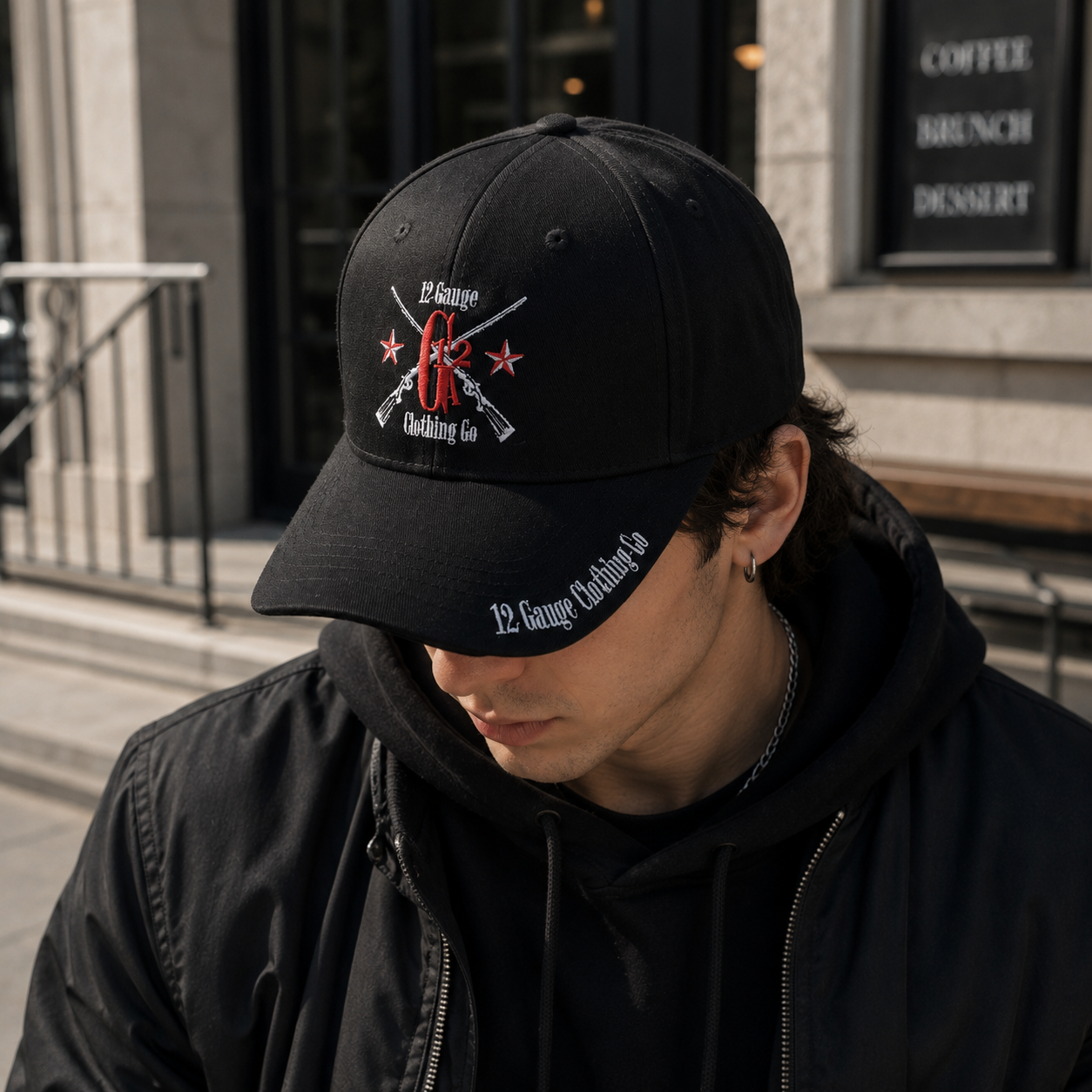 Black Six-Panel Baseball Cap with Red and White Crossed-Rifle Embroidery