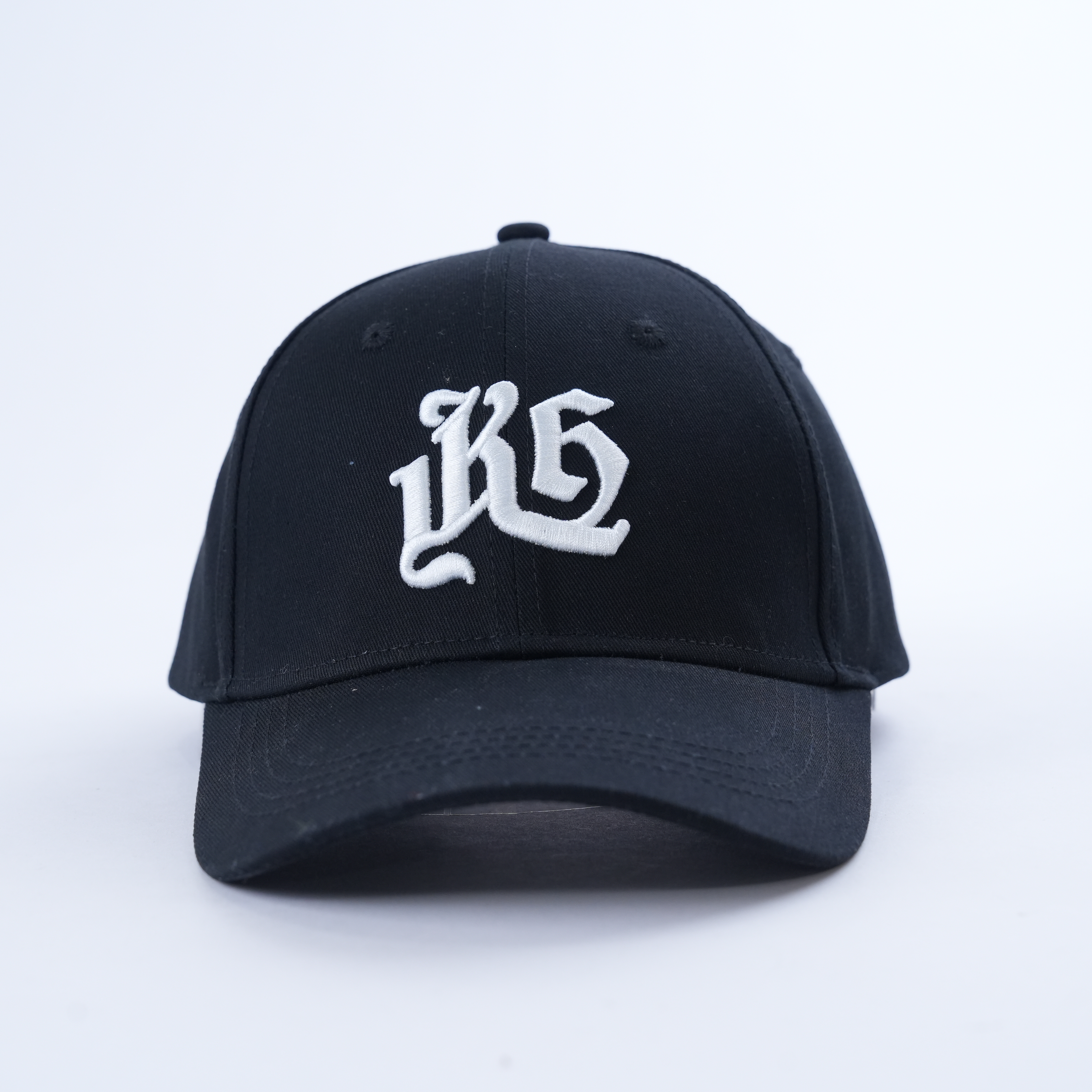 Black Six-Panel Curved Brim Cap with White Gothic Monogram
