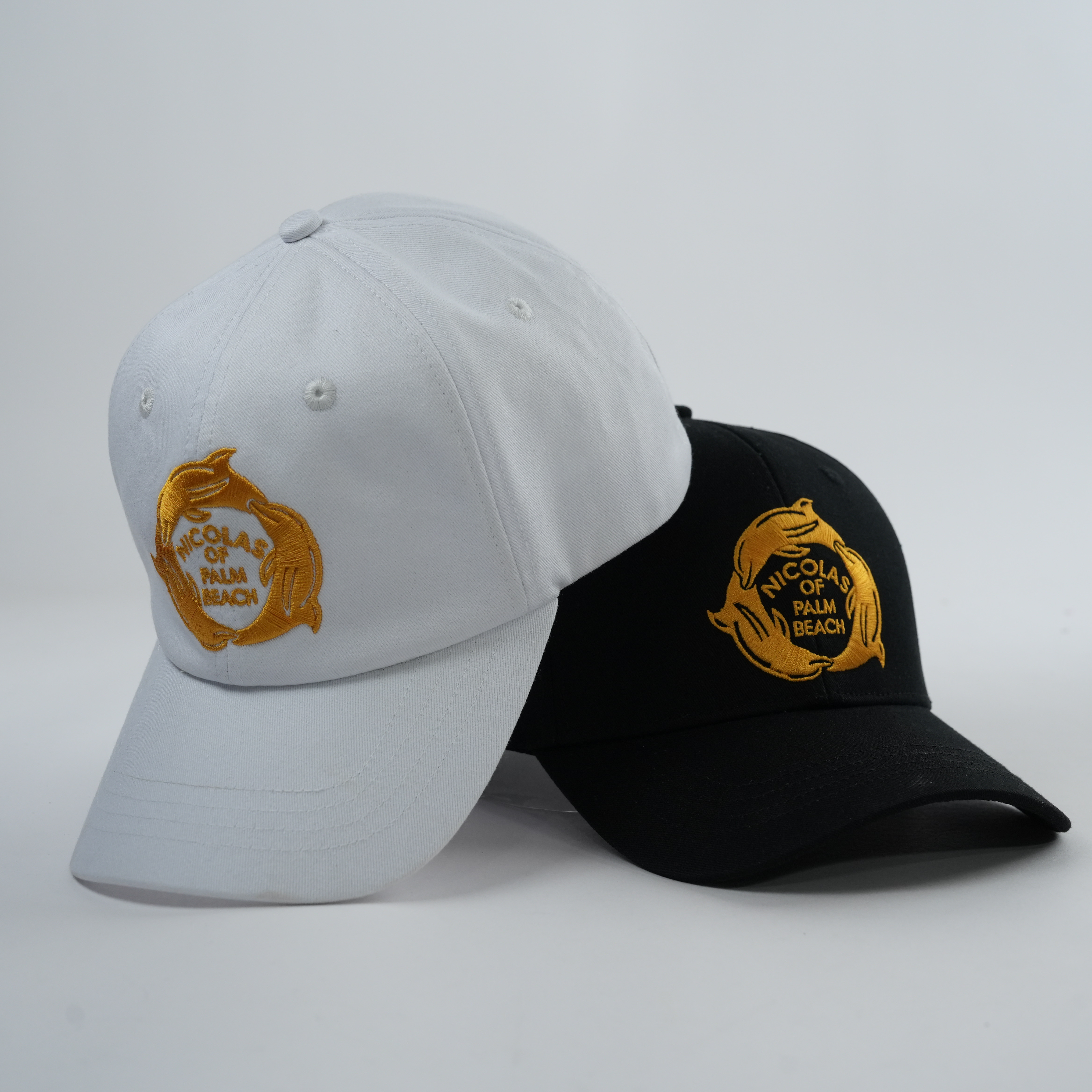 Black and White Structured Cotton Caps with Gold Fish Emblem
