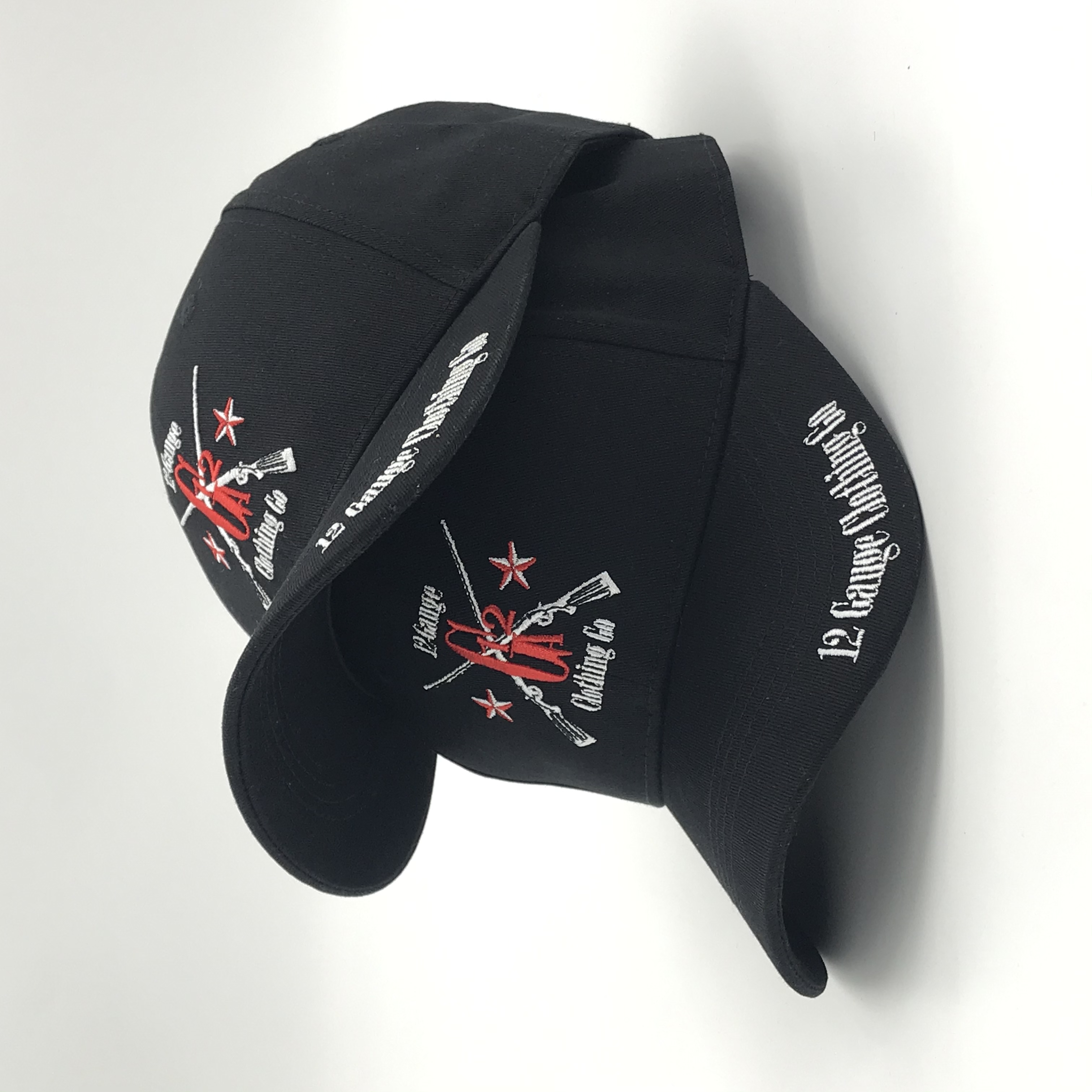 Black Six-Panel Baseball Cap with Red and White Crossed-Rifle Embroidery