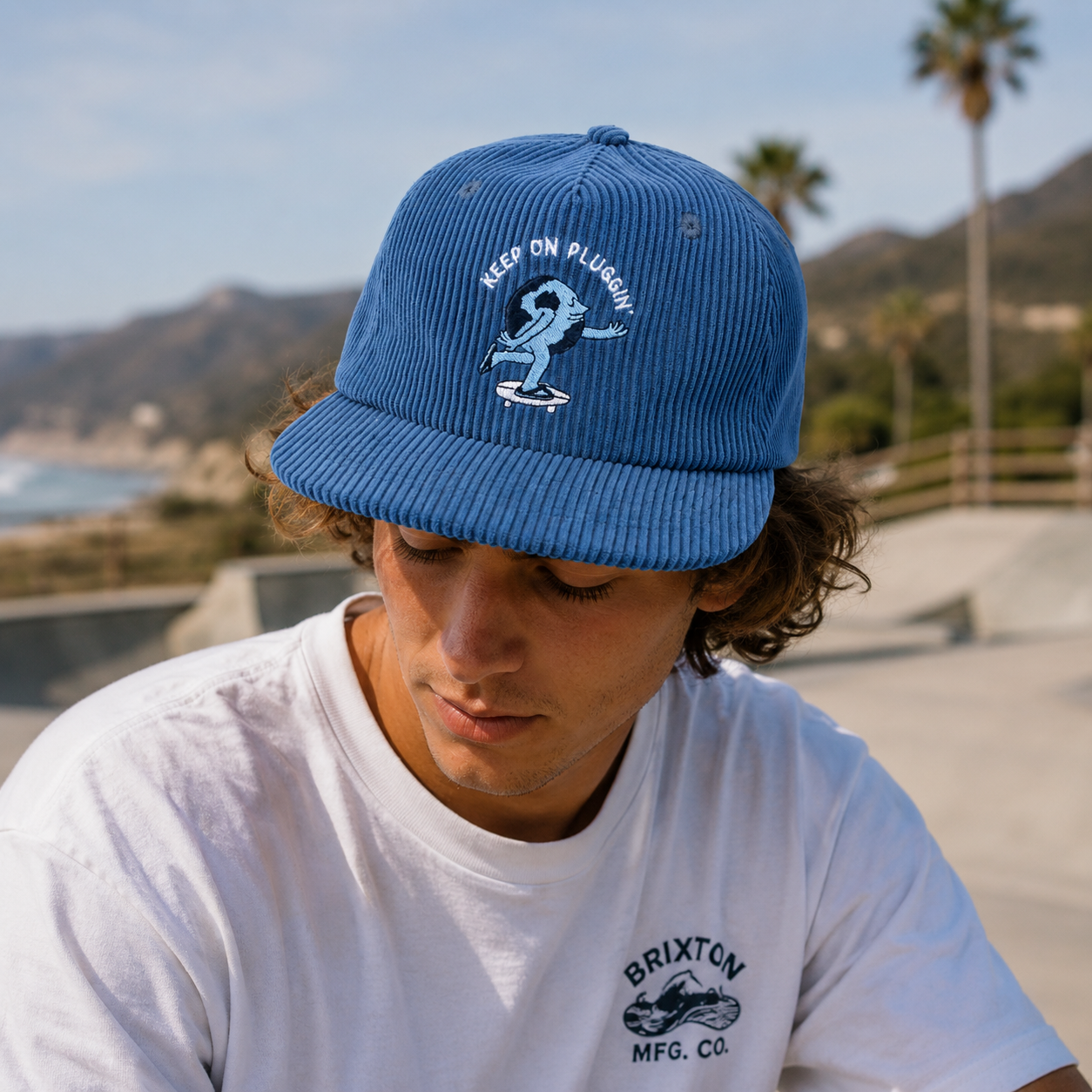 Blue Corduroy Snapback Cap with Embroidered Skateboard Character Logo