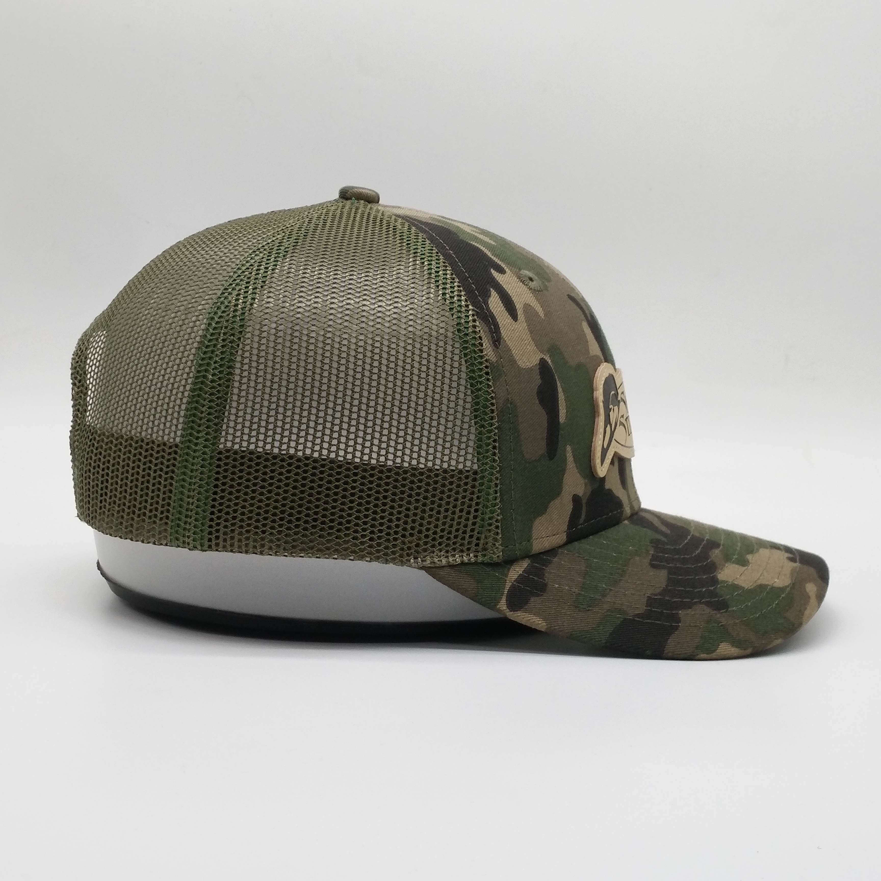 Camouflage Mesh Trucker Hat with Oval Leather Patch - Sling’n Stitches Logo Cap