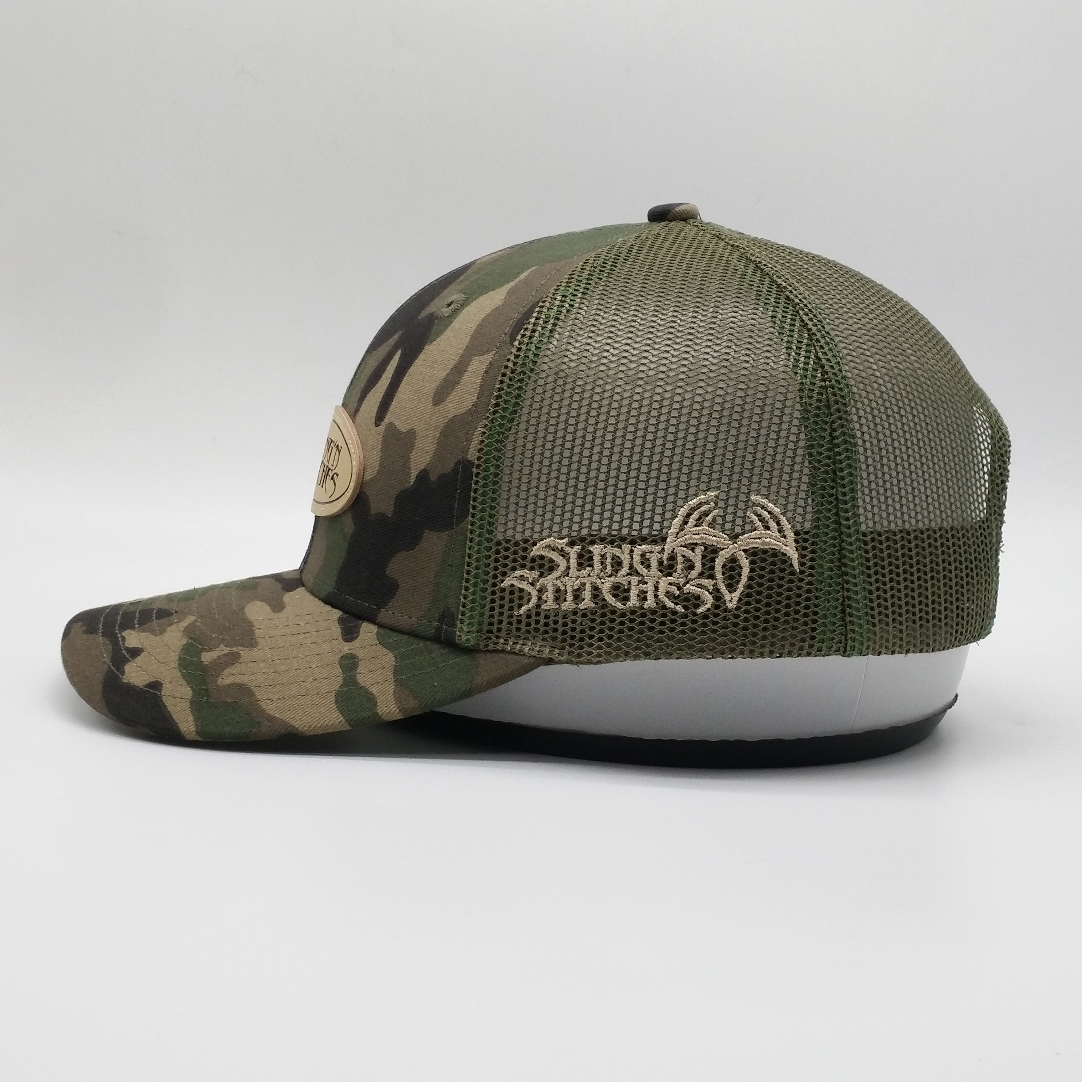 Camouflage Mesh Trucker Hat with Oval Leather Patch - Sling’n Stitches Logo Cap
