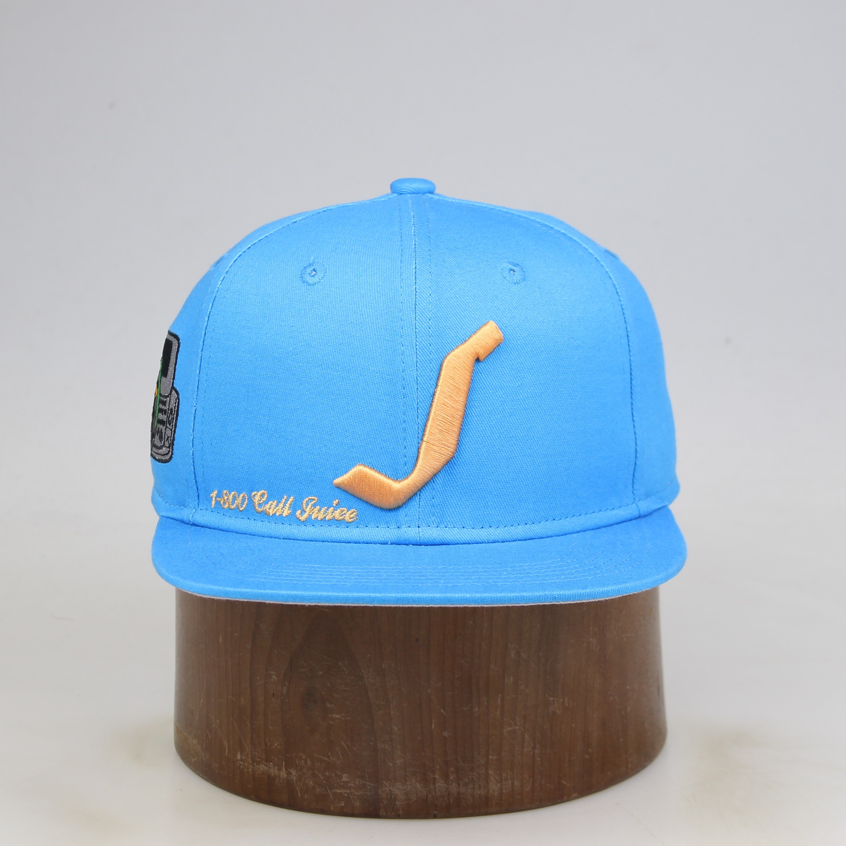 Sky Blue Flat-Brim Six-Panel Snapback with Gold Curved-Logo Embroidery