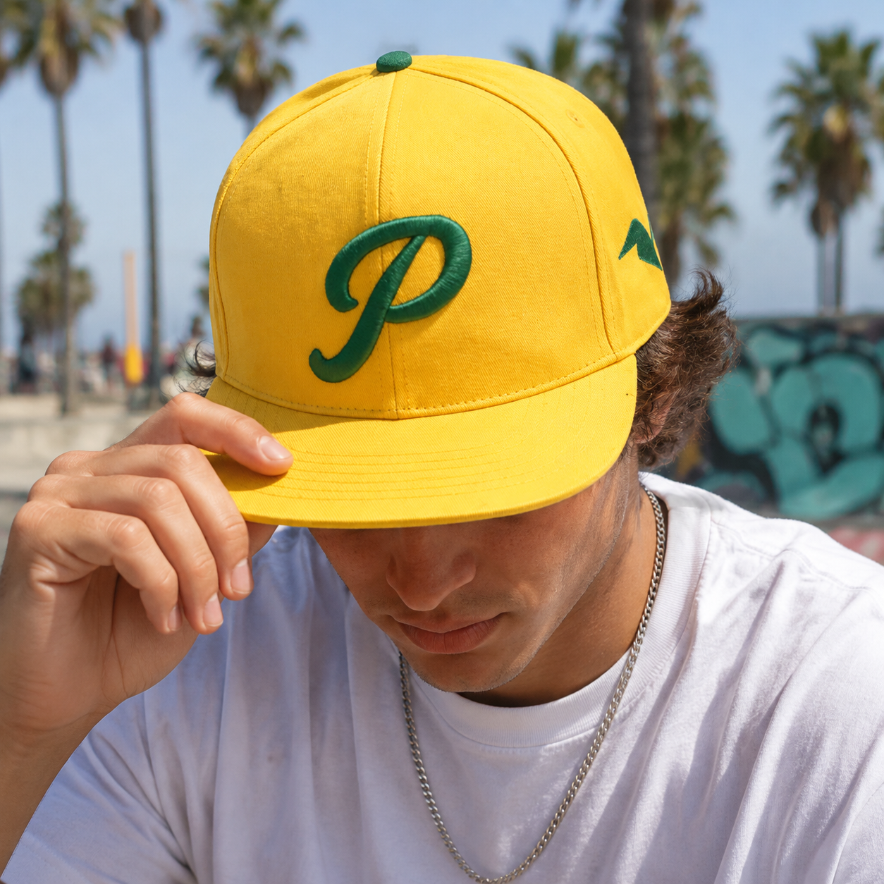 Yellow Flat Brim Snapback Cap with Green Raised Embroidered Logo and Streetwear Style Design