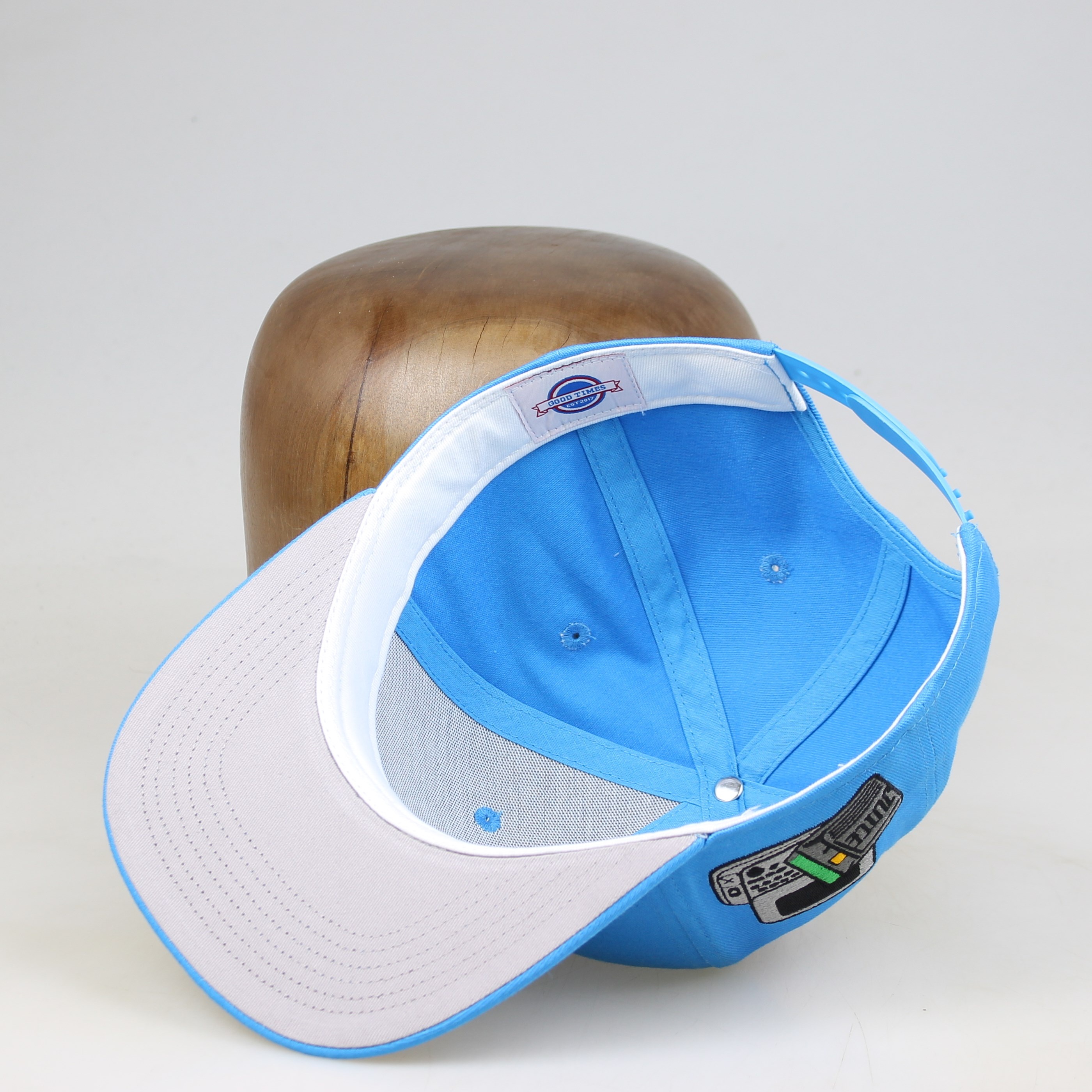 Sky Blue Flat-Brim Six-Panel Snapback with Gold Curved-Logo Embroidery