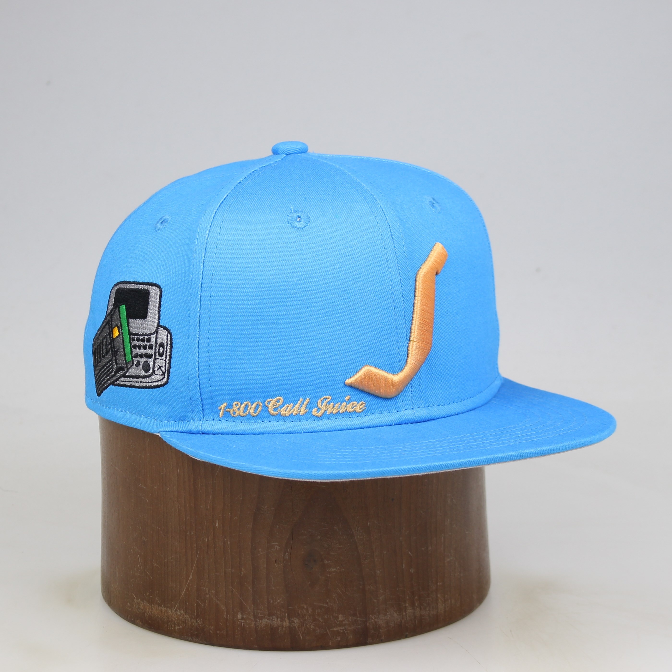 Sky Blue Flat-Brim Six-Panel Snapback with Gold Curved-Logo Embroidery