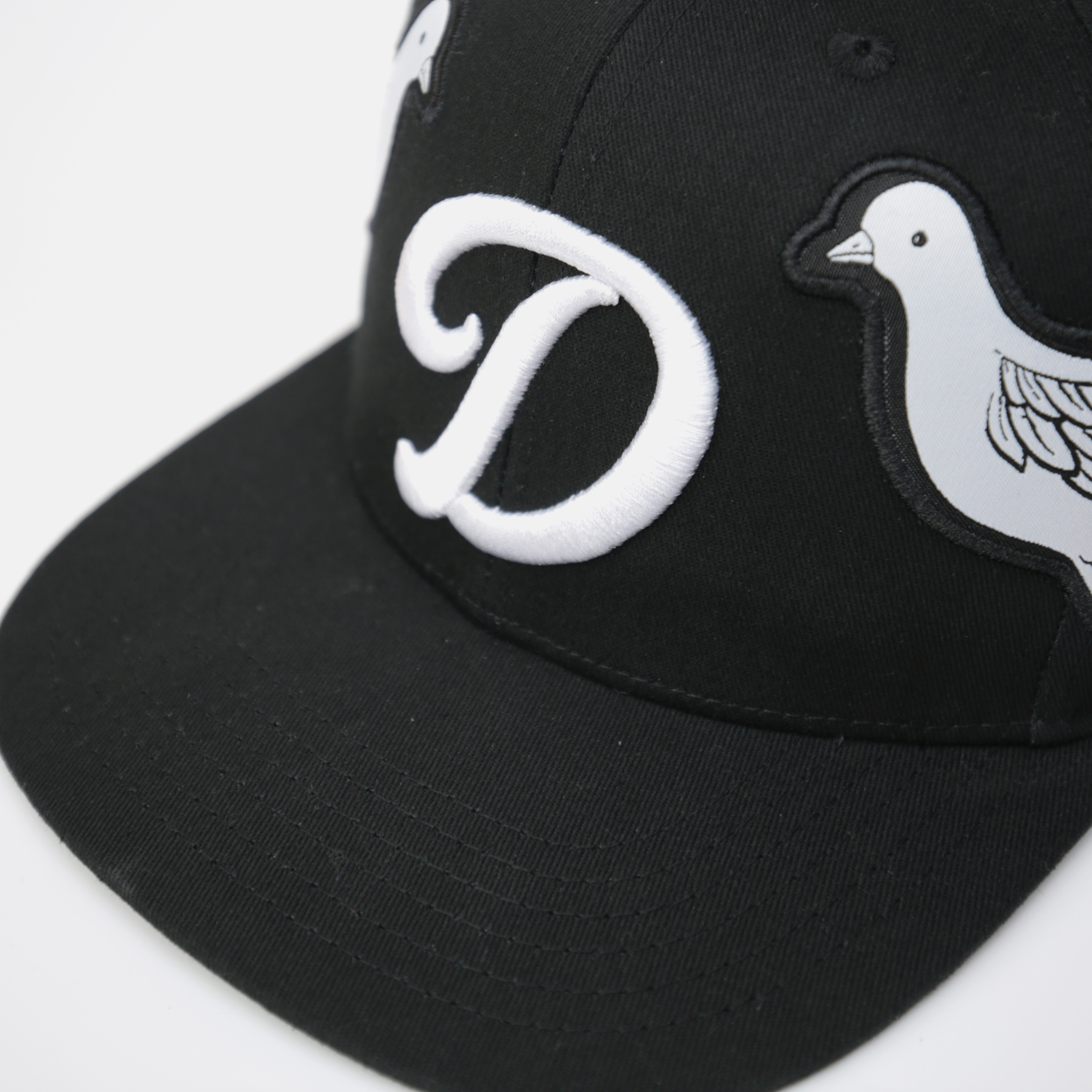 Black Snapback Cap with 3D “D” Embroidery and Flying Dove Patches – Streetwear Flat Brim Hat
