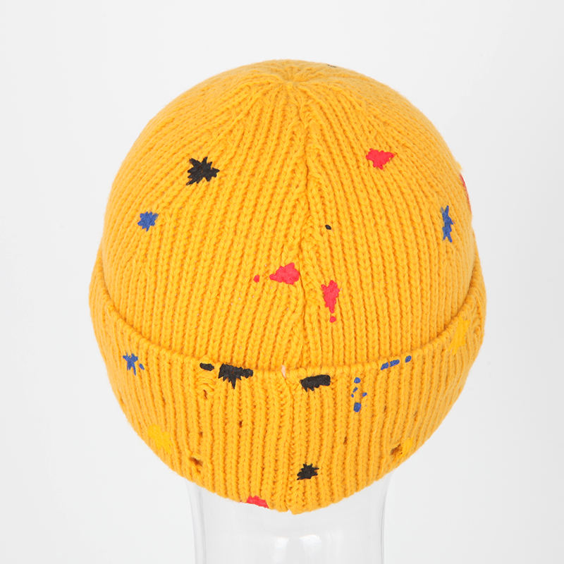 Mustard Yellow Rib-Knit Cuffed Beanie with Paint-Splatter Accents and Woven Patch