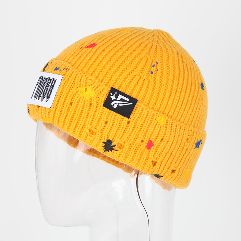 Mustard Yellow Rib-Knit Cuffed Beanie with Paint-Splatter Accents and Woven Patch