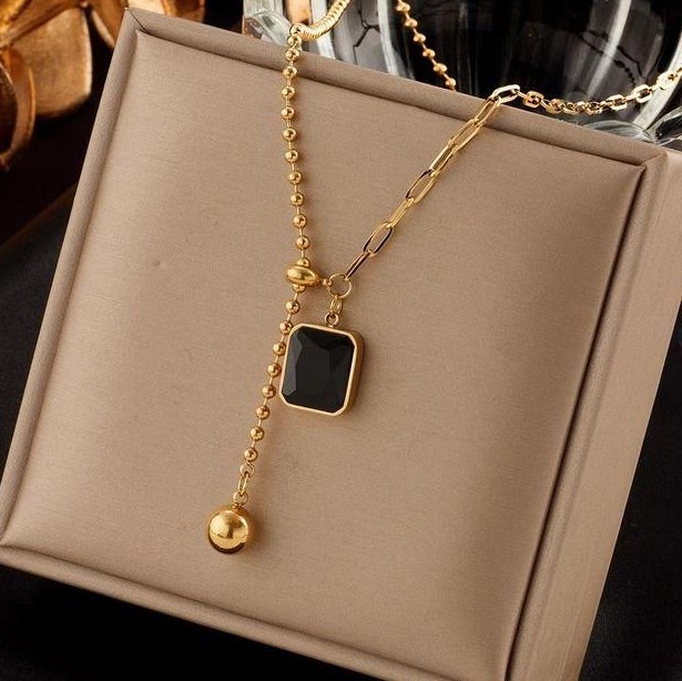 Modern Gold Titanium Steel Necklace with Black Pendant and Asymmetric Chain Design