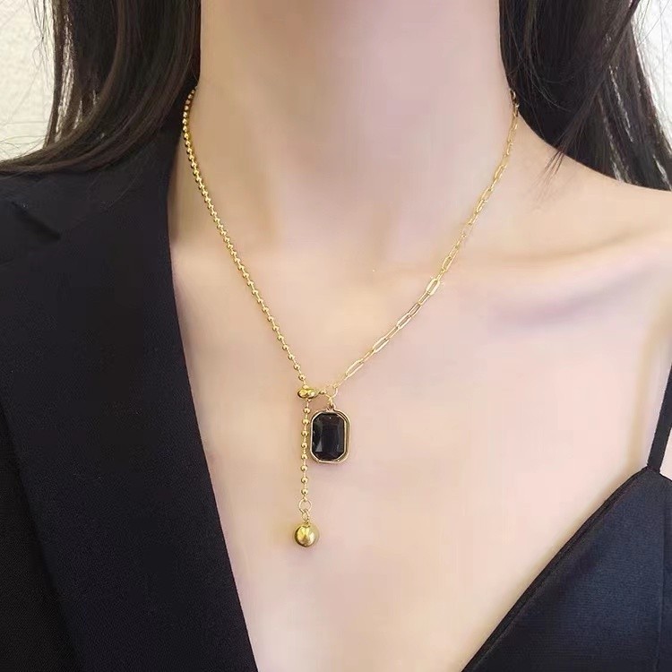 Modern Gold Titanium Steel Necklace with Black Pendant and Asymmetric Chain Design