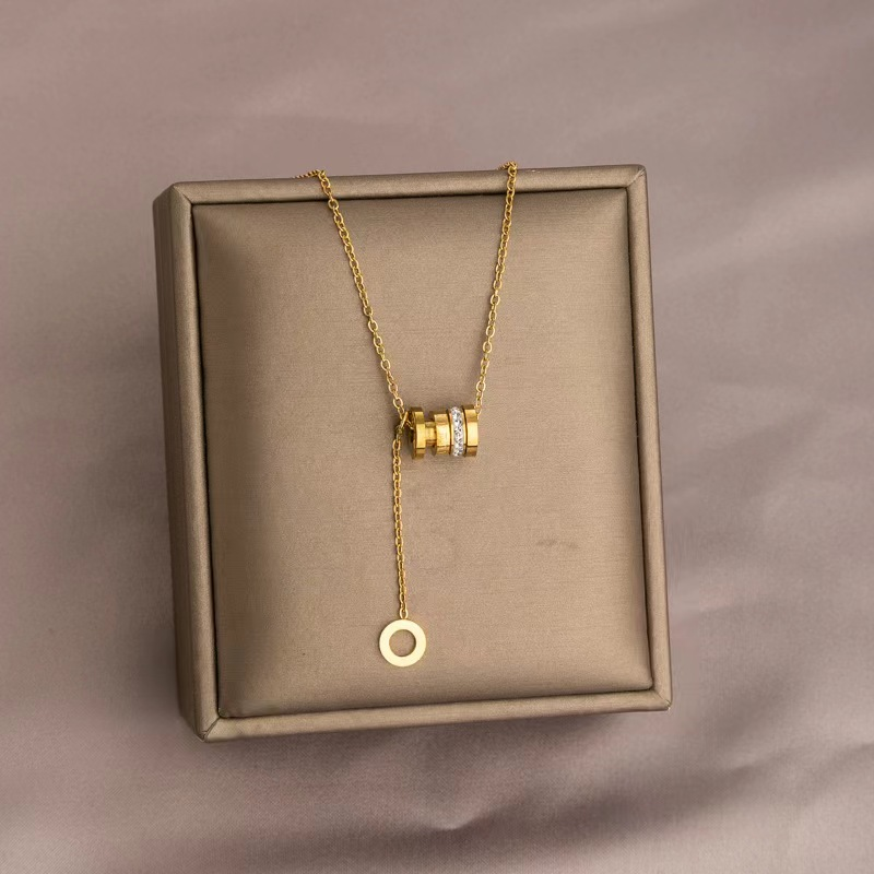 Gold Barrel Pendant Necklace with Double Ring Accents and Drop Charm