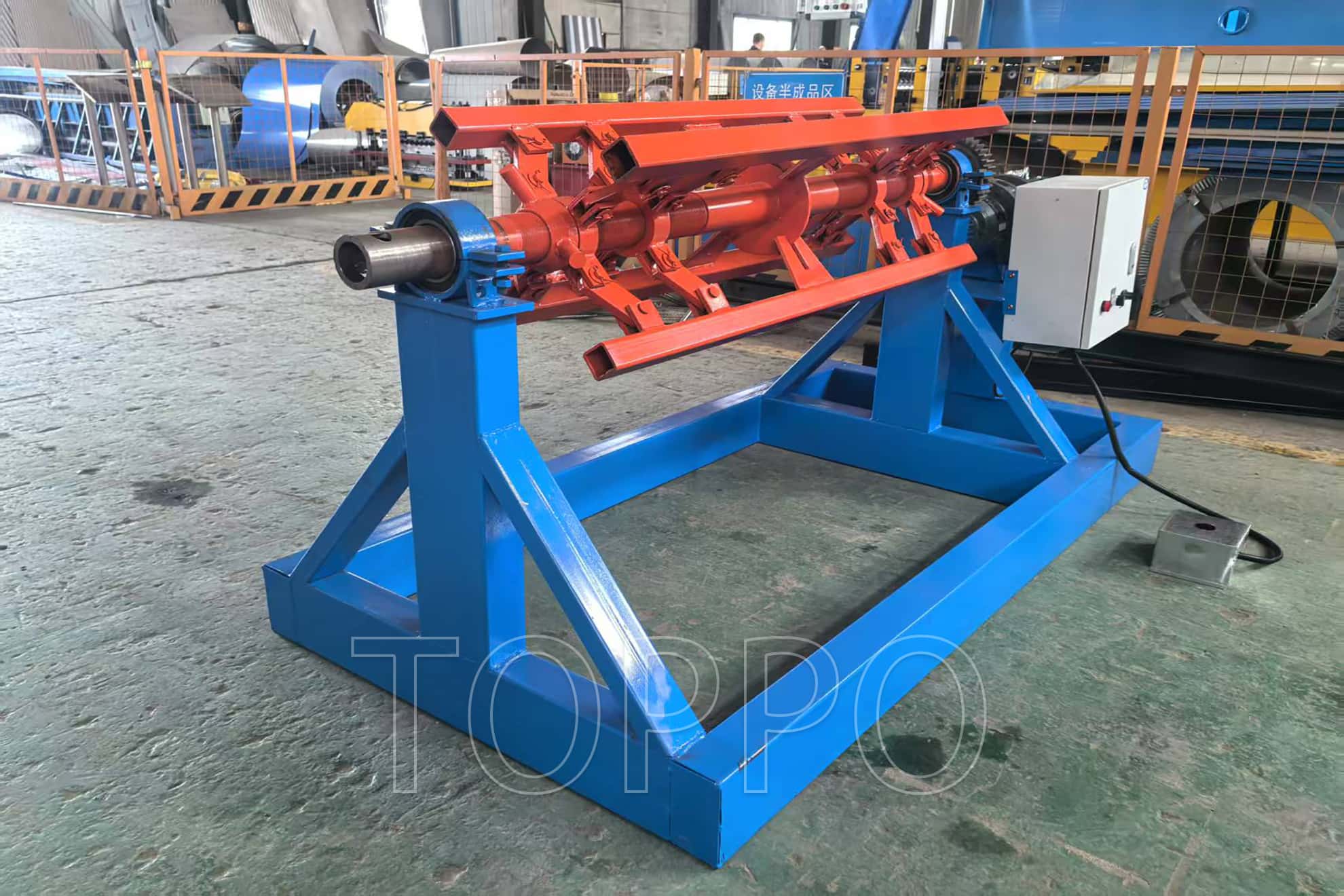 Electric Decoiler with Red Expansion Arm and Control Panel