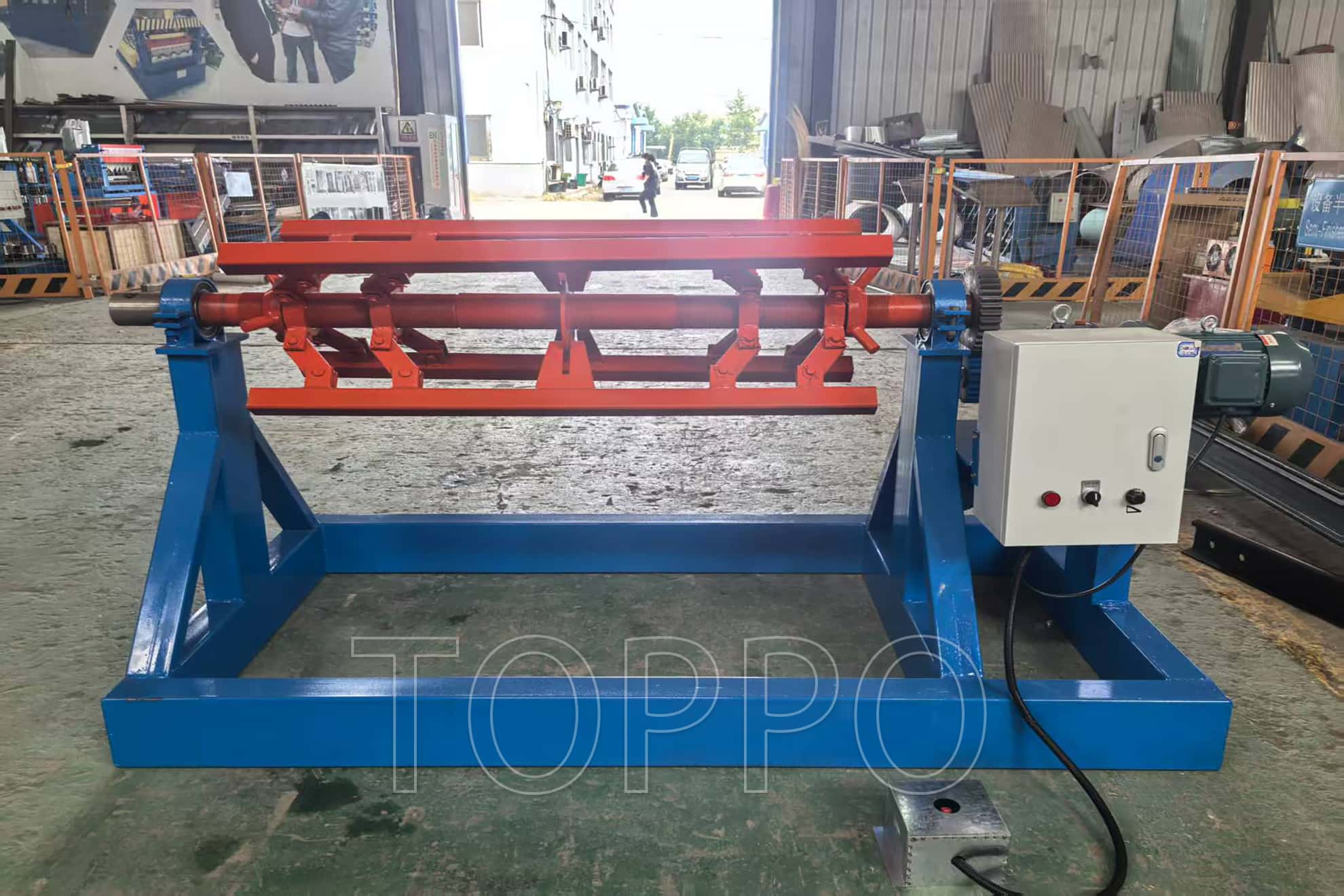 Electric Decoiler with Red Expansion Arm and Control Panel