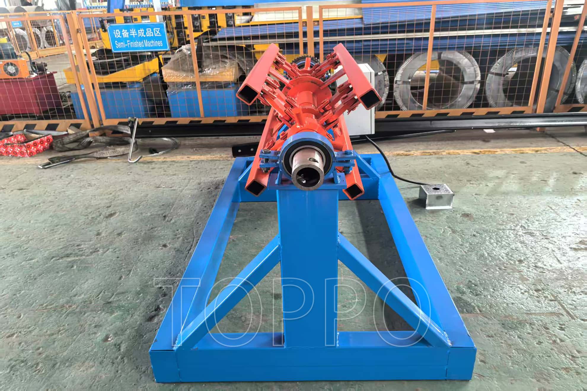 Electric Decoiler with Red Expansion Arm and Control Panel