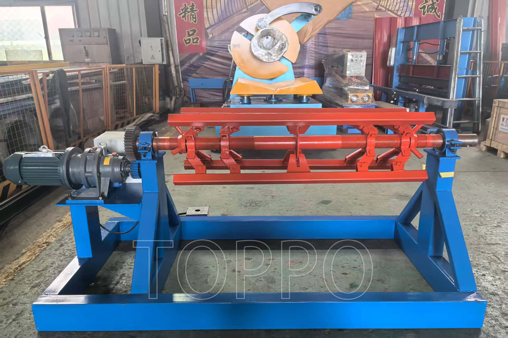 Electric Decoiler with Red Expansion Arm and Control Panel