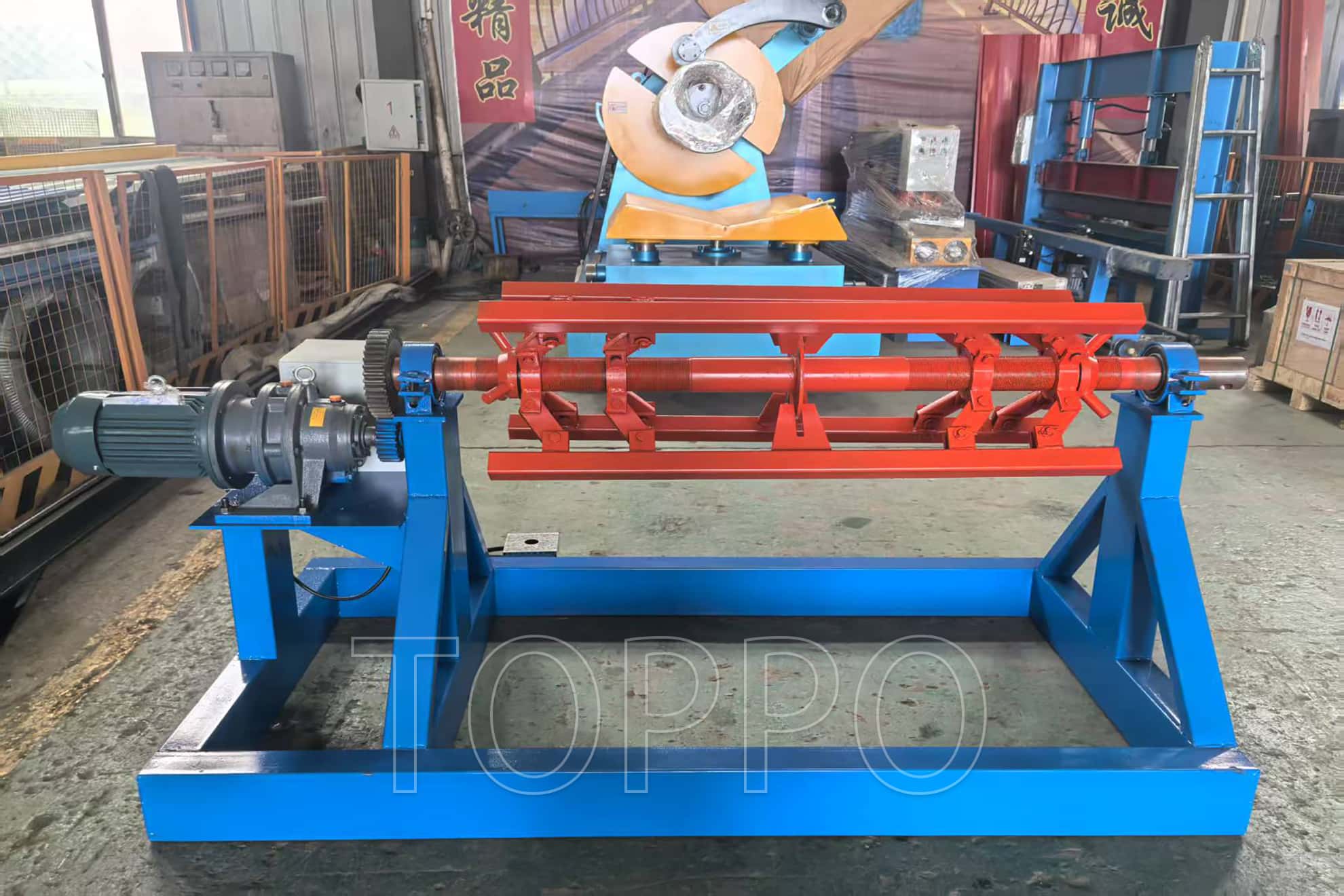 Electric Decoiler with Red Expansion Arm and Control Panel