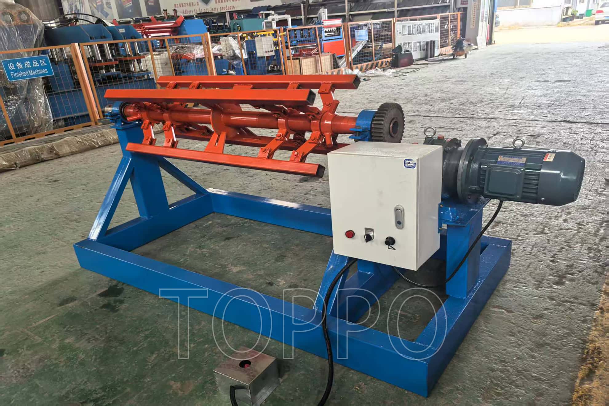 Electric Decoiler with Red Expansion Arm and Control Panel