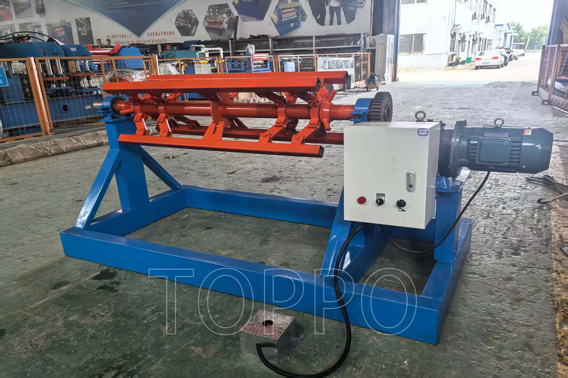 Electric Decoiler with Red Expansion Arm and Control Panel